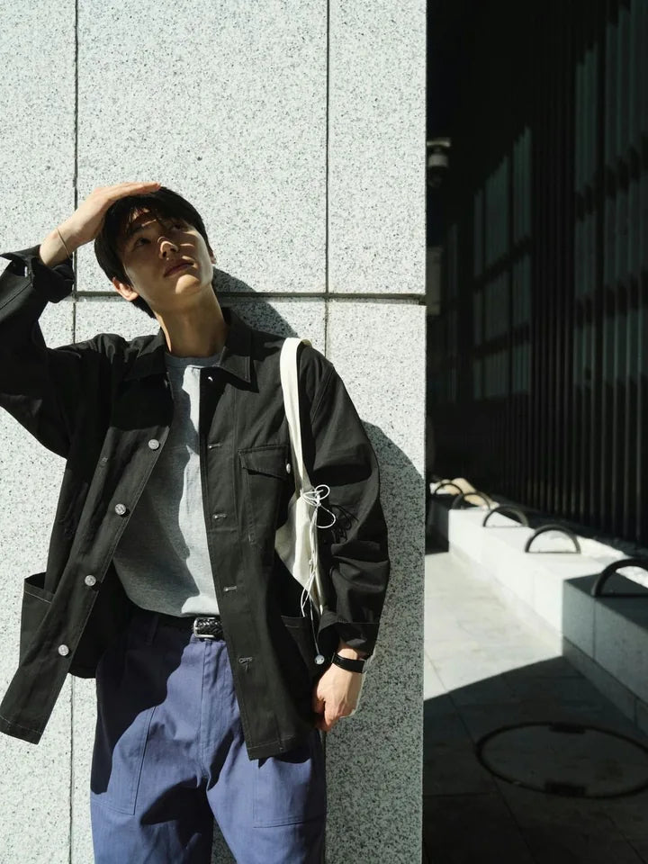 A charcoal jacket and blue pants on an afternoon in the alley — 1